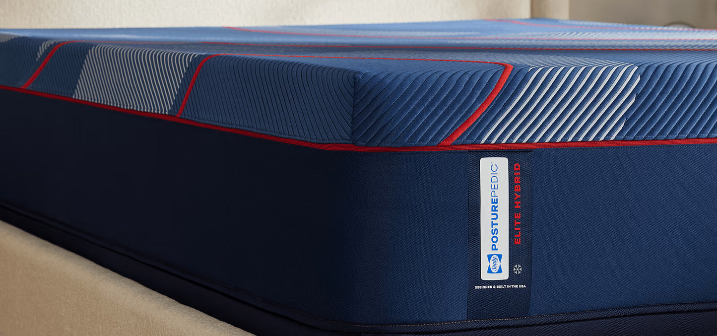 Blue mattress with a visible brand label on a neutral background