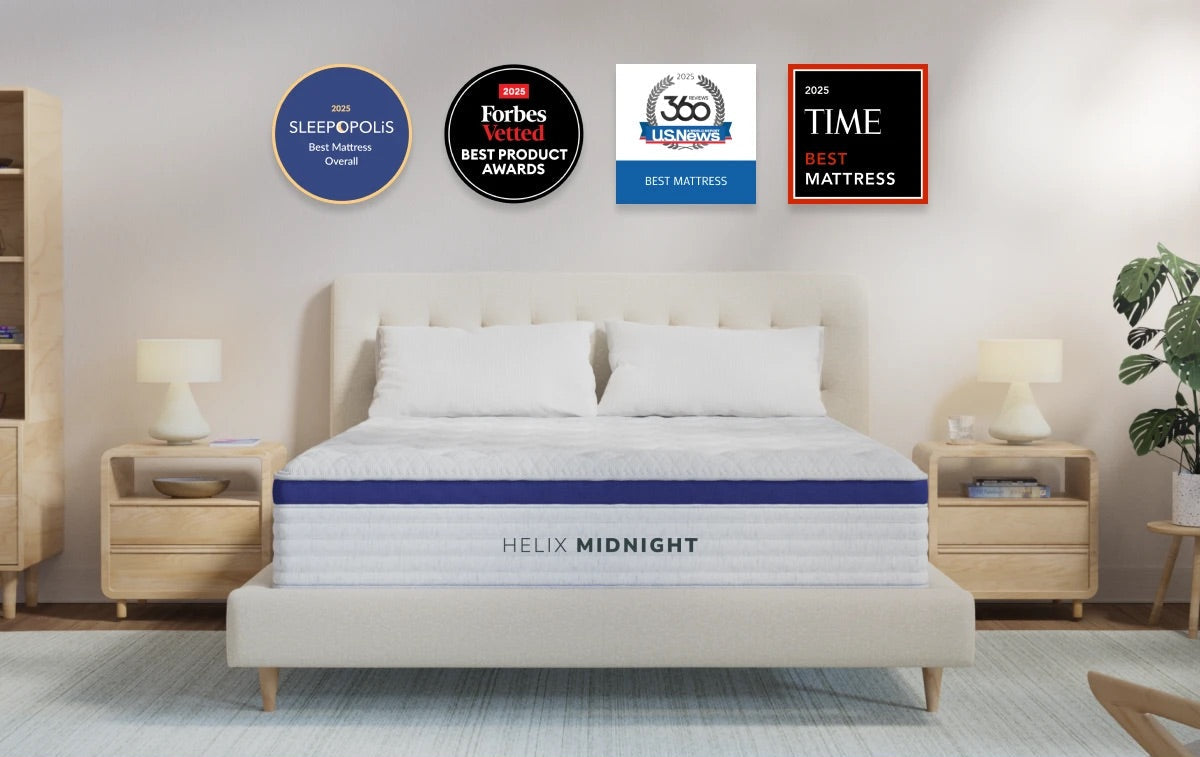 Helix Midnight mattress in a bedroom setting with various awards displayed above.