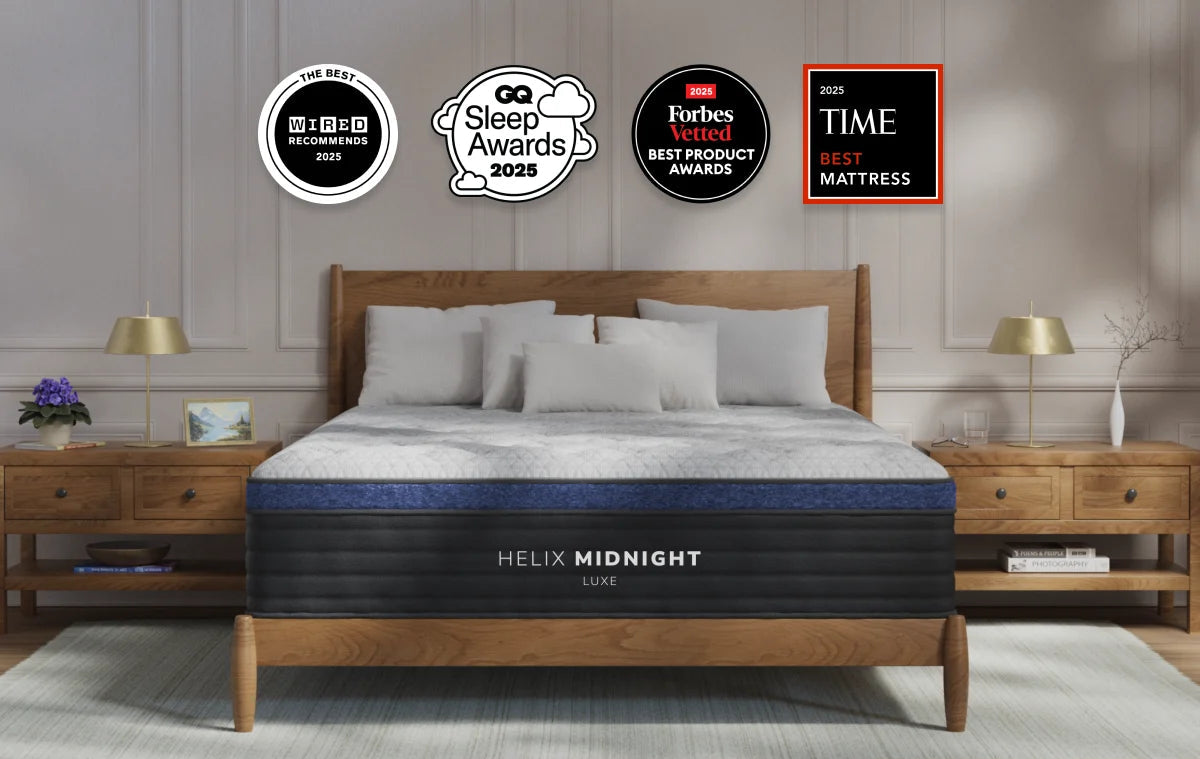Helix Midnight mattress in a bedroom setting with various awards displayed above it.