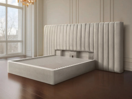 Beige upholstered bed with tufted headboard in a room with large windows.