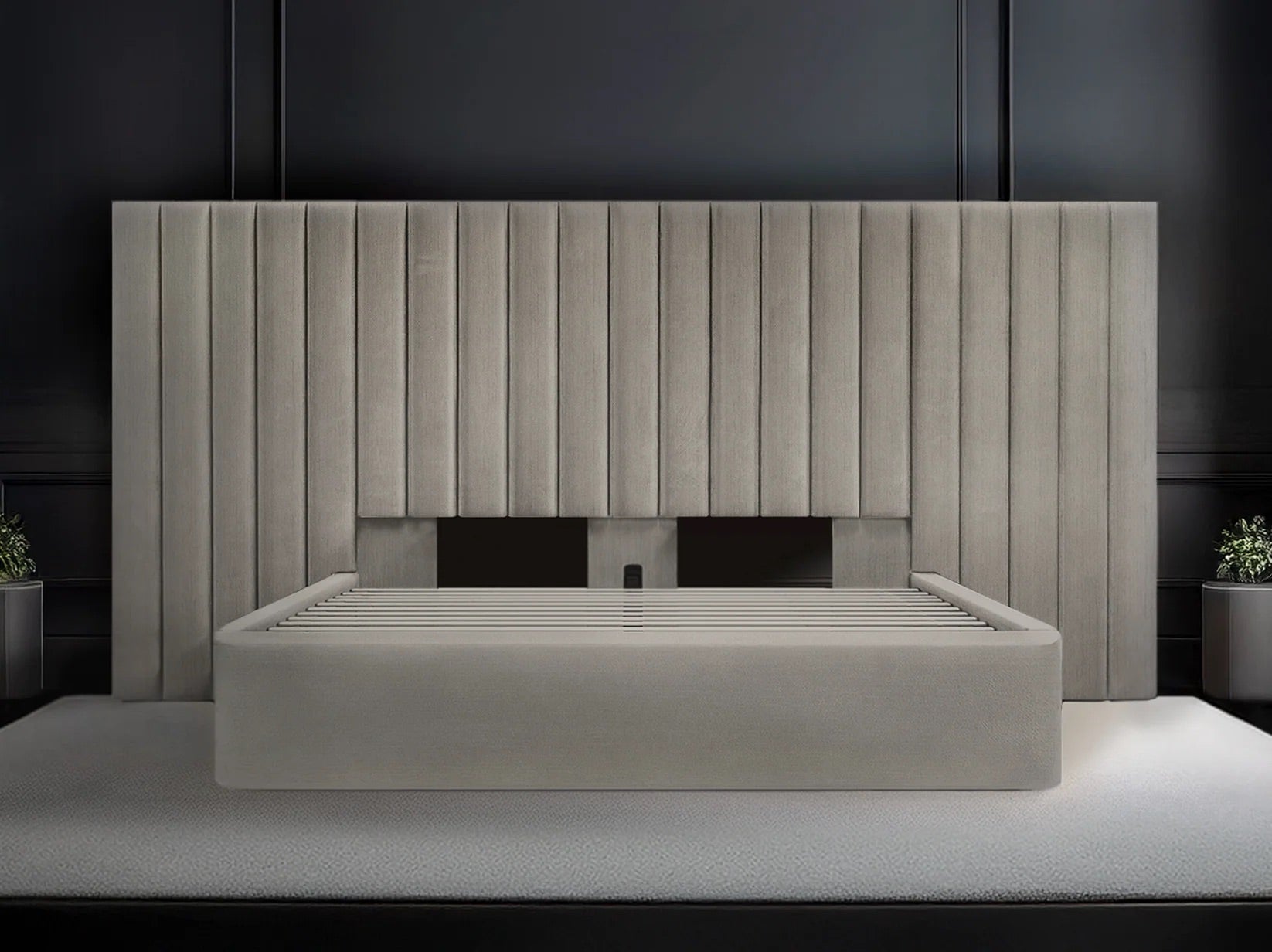 Modern bed with a large headboard in a dark room
