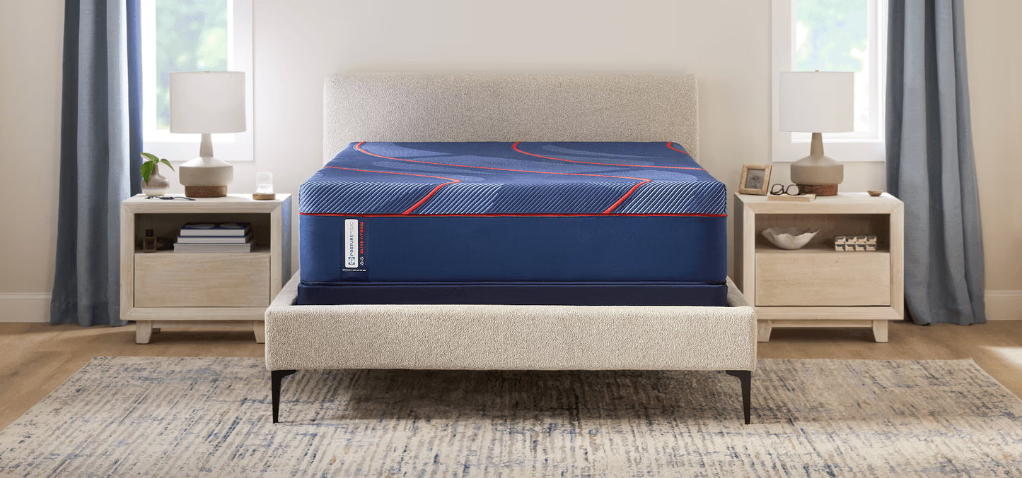 Blue mattress on a bed in a bedroom setting