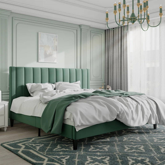 King size green velvet upholstered platform bed in a stylish bedroom with a chandelier and artwork.