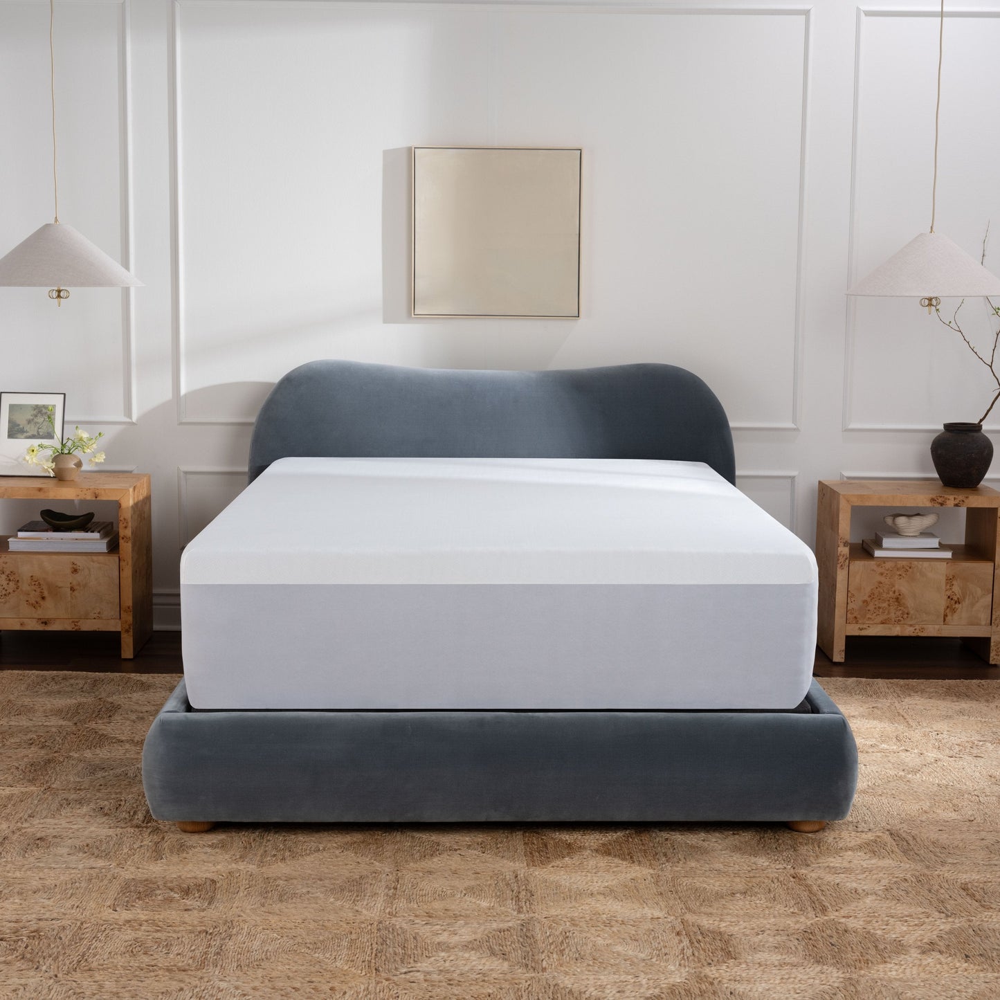 Waterproof mattress protector on purple mattress in bedroom