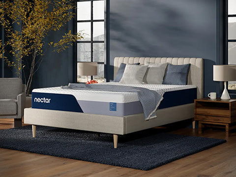 Nectar mattress in a bedroom setting with a bed and pillows.