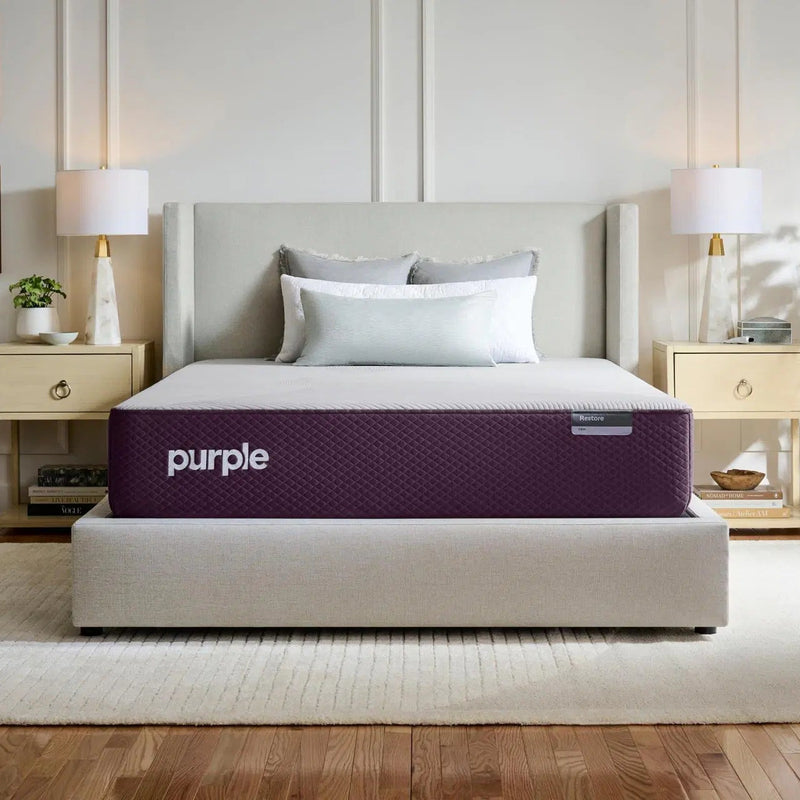 Purple mattress in a bedroom setting with a neutral color scheme.