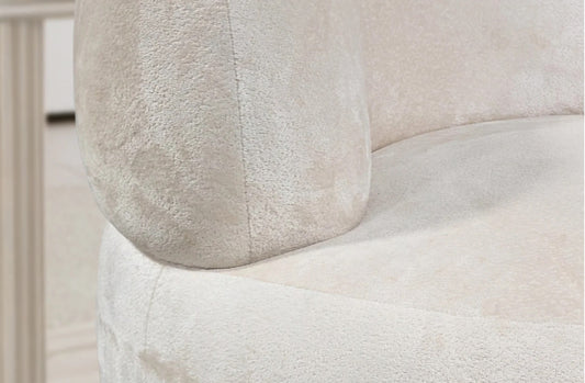 Close-up of a textured white cushion on a chair
