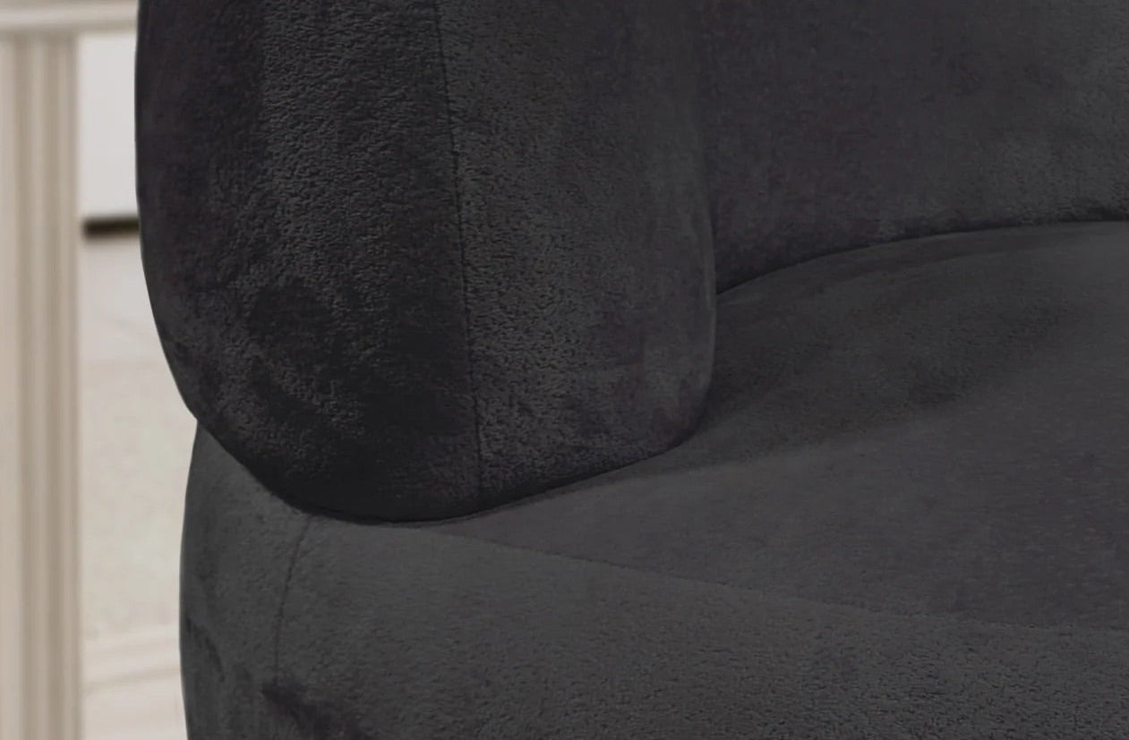 Close-up of a dark gray cushion on a chair