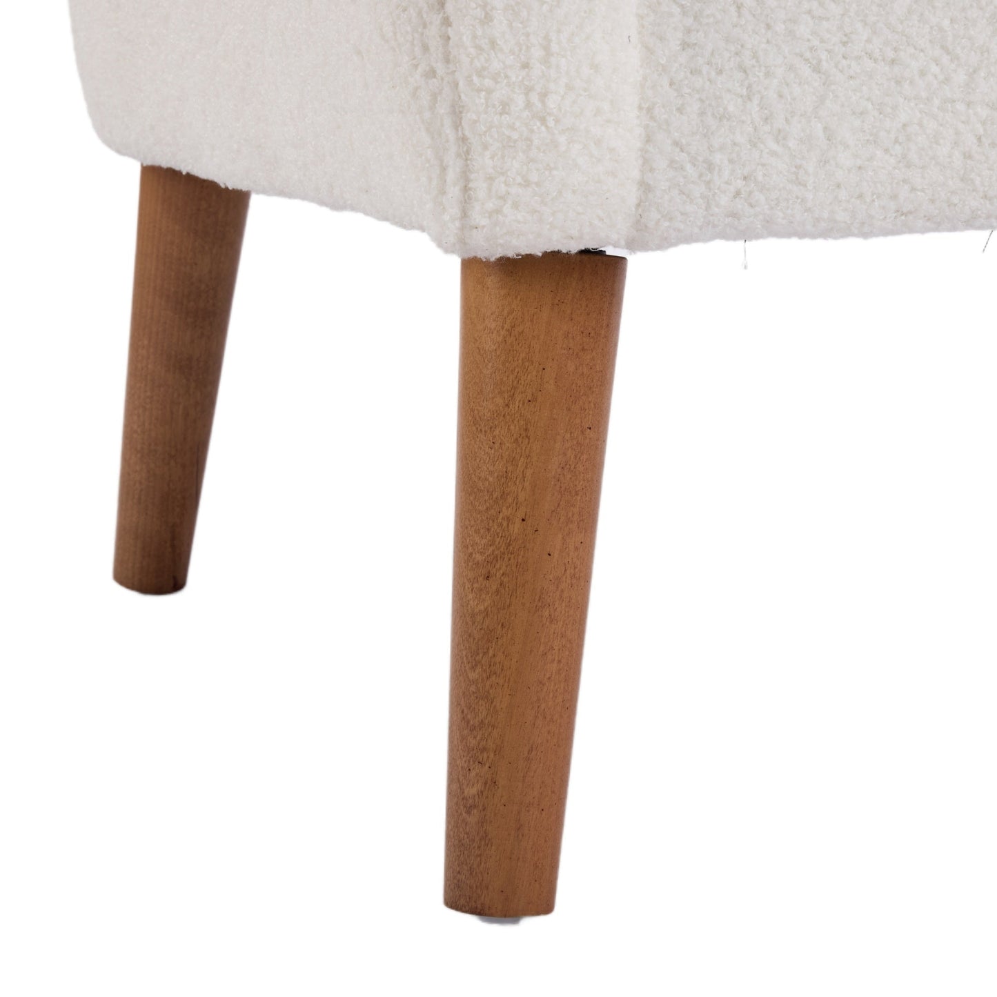Close-up of the accent chairs wooden legs on a white background