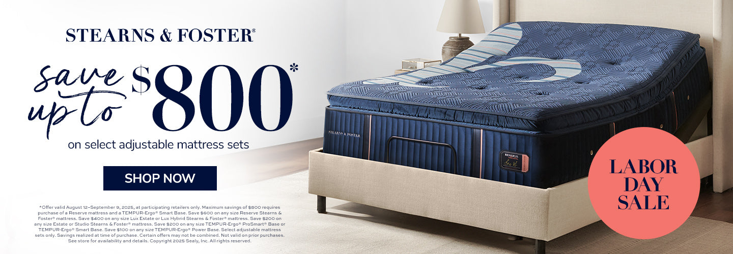 Stearns & Foster mattress on a bed with Labor Day sale text and promotional offer.