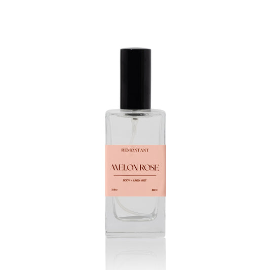 Luxury linen mist glass bottle labeled 'Melon Rose' by Remontant on a white background