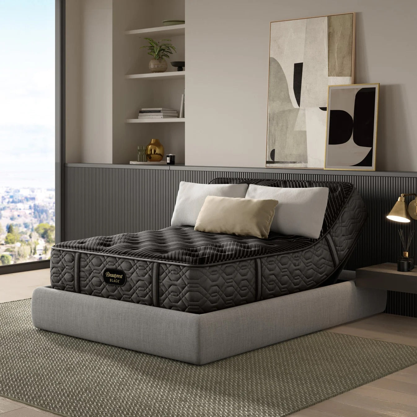 Modern bedroom with a beautyrest black on an adjustable bed frame and decorative elements.