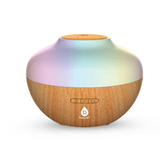Multicolored diffuser with wooden base on a white background