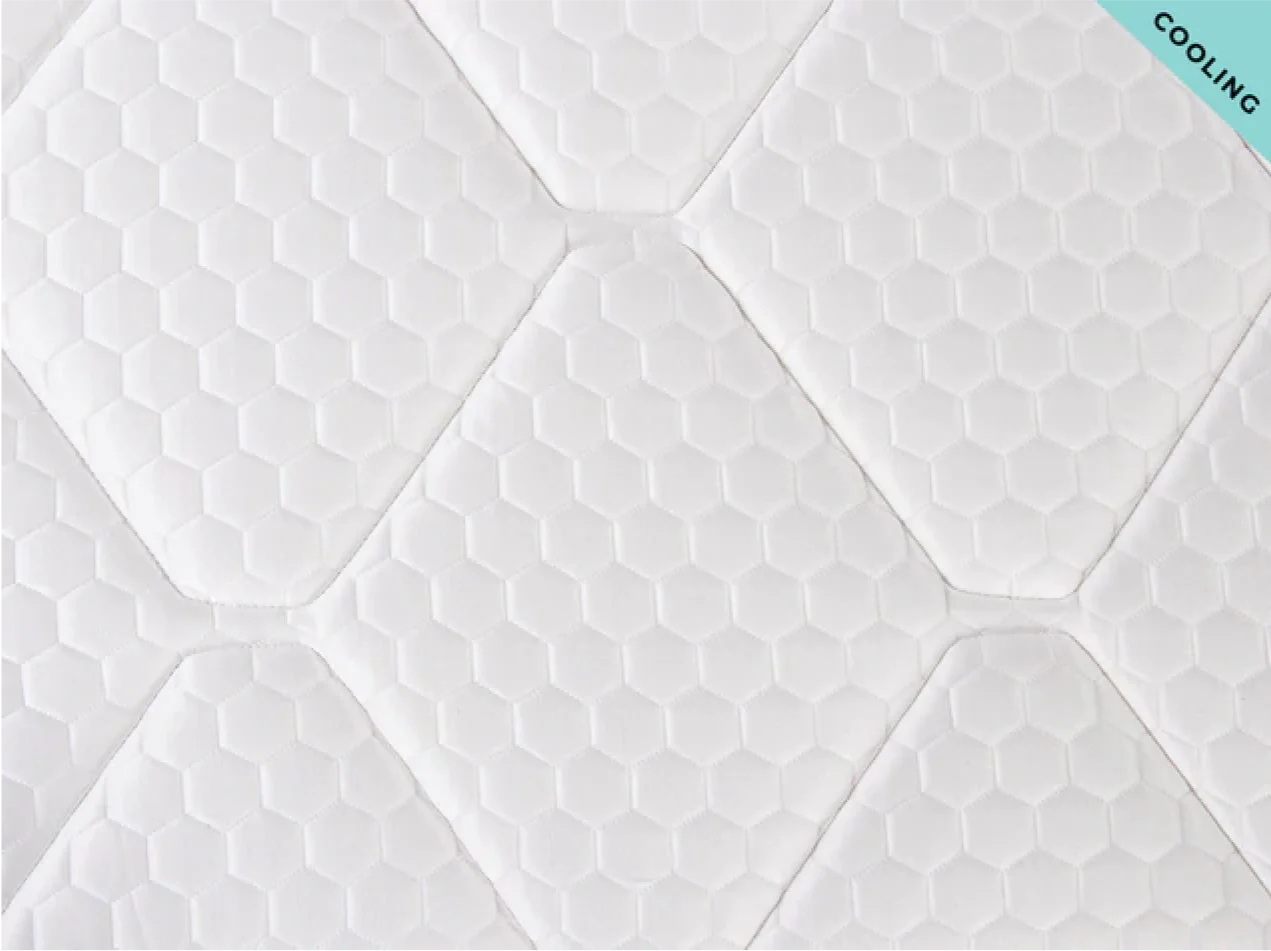 Textured white mattress with 'Cooling' label in the corner