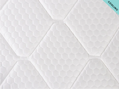 Textured white mattress with 'Cooling' label in the corner