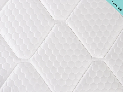 Hexagonal patterned mattress topper with 'Cooling' label