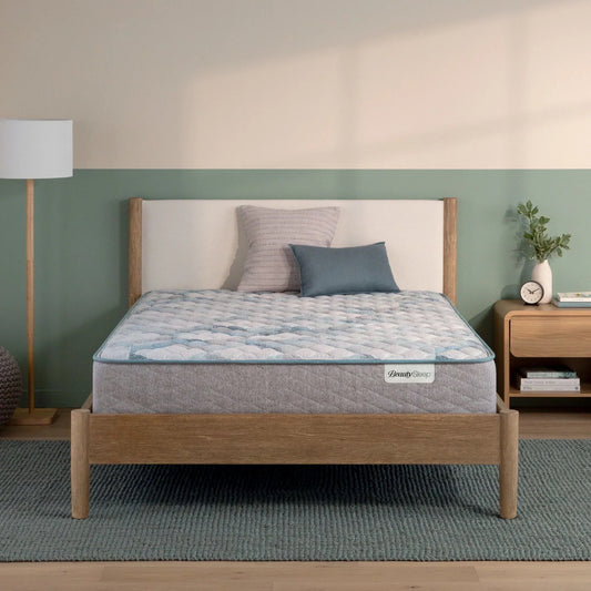Bed with a mattress on a wooden bed frame in a bedroom setting.