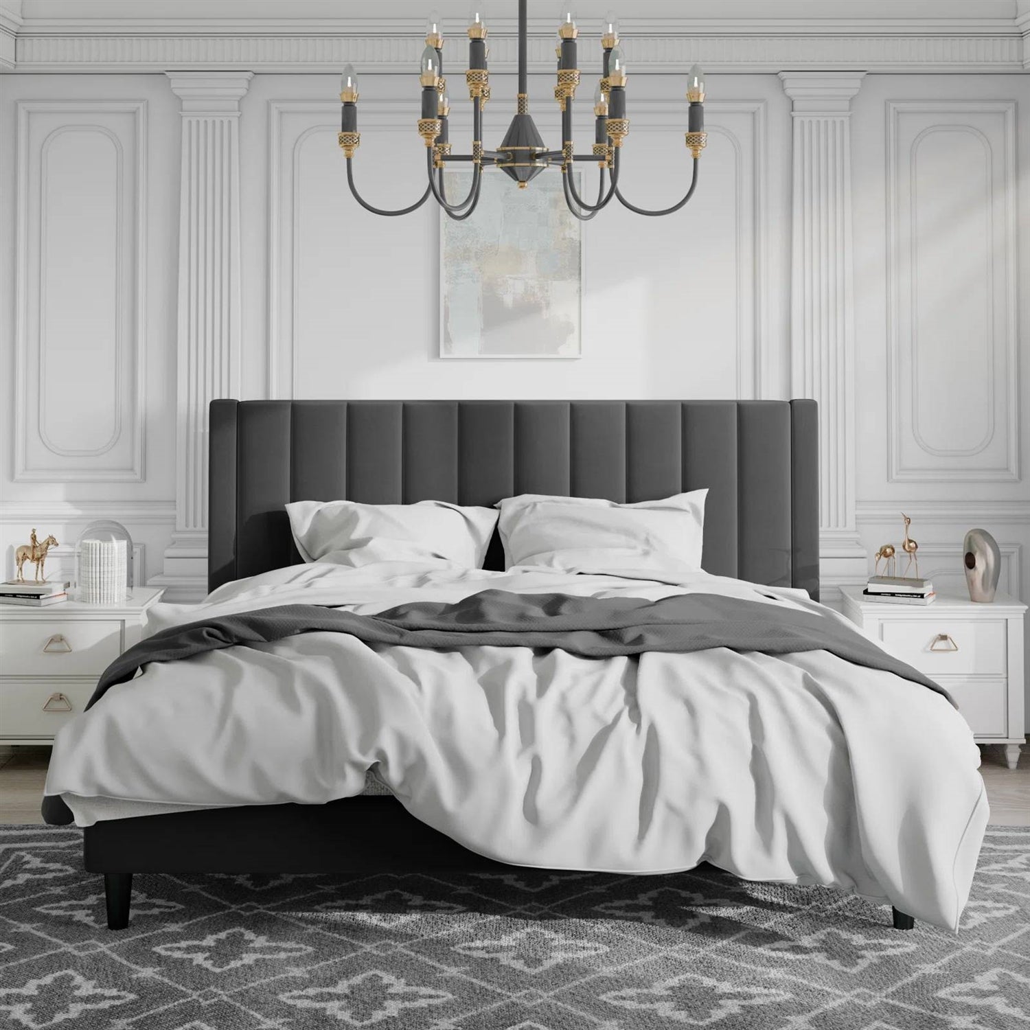 King size velvet upholstered bed in a bedroom with white walls and decorative elements.