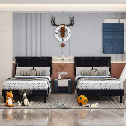 Children's bedroom with two black platform beds, toys, and a clock on the wall.