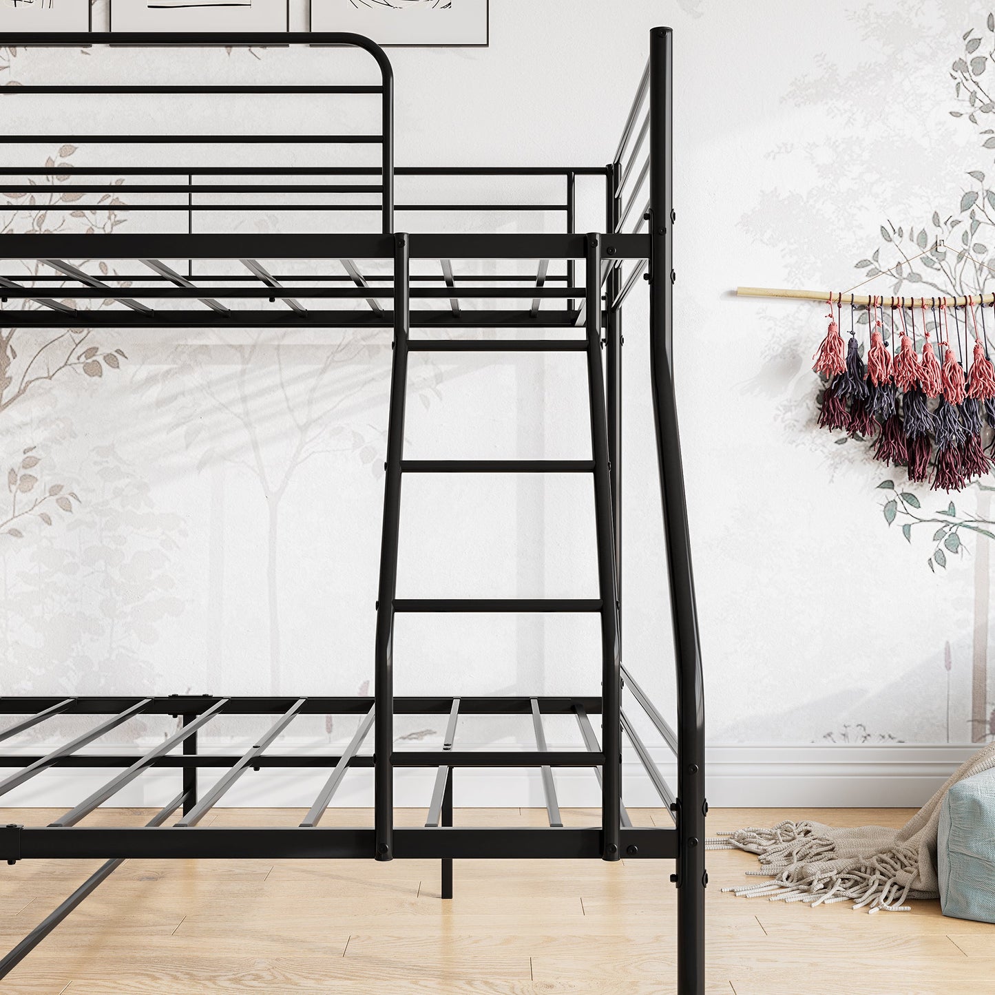 Twin over full size sturdy black metal bunk bed in a room with a white wall and wooden floor.