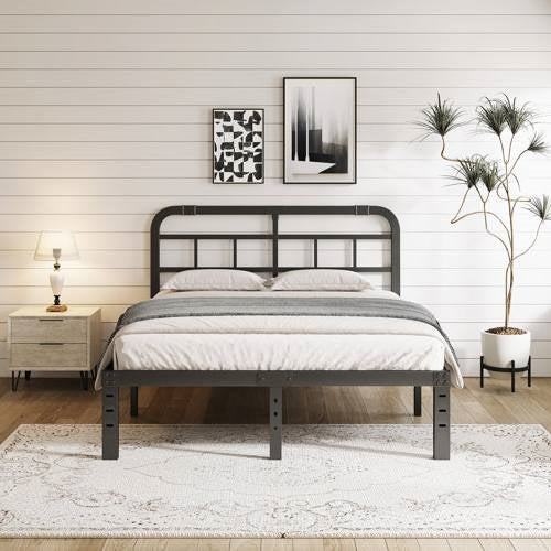 Black metal cal king bed frame in a bedroom setting with decor elements.