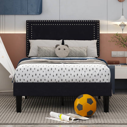 Bedroom with a bed featuring star-patterned bedding, a black headboard, and a soccer ball on the floor.