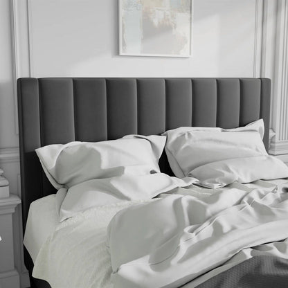 Black velvet full size tu upholstered headboard with white bedding in a luxury modern bedroom setting