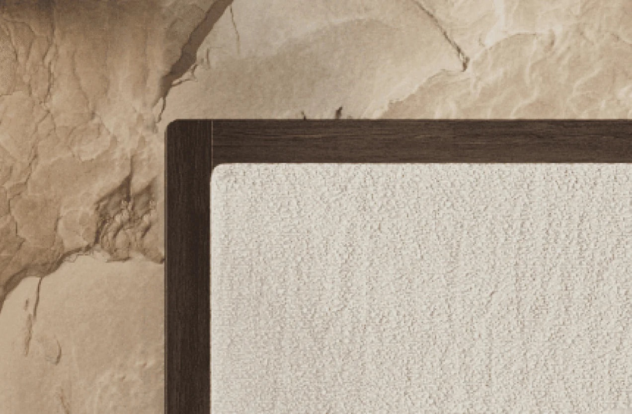 Close-up of a textured wall with a wooden frame