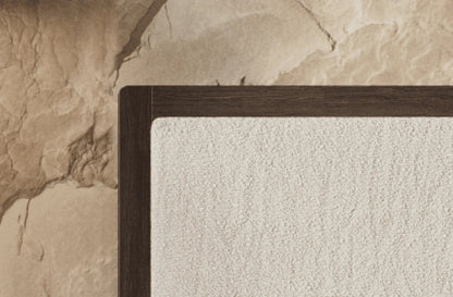 Close-up of a textured wall with a wooden frame