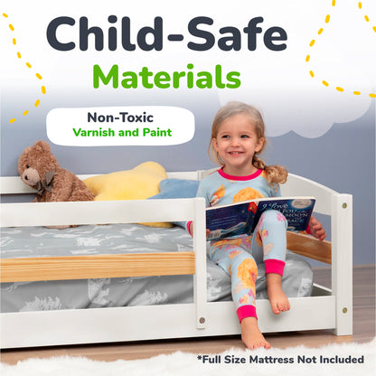 Child reading a book in a bed with child-safe materials and non-toxic varnish and paint.