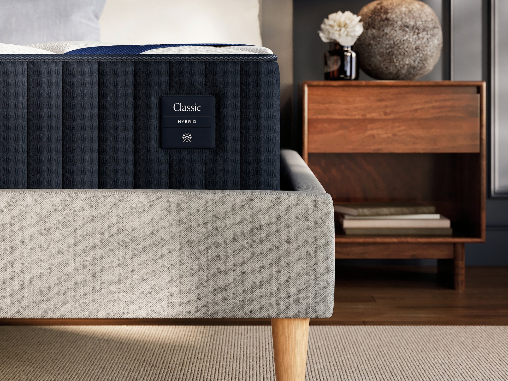 Blue mattress with 'Classic' label on a bed in a bedroom setting.