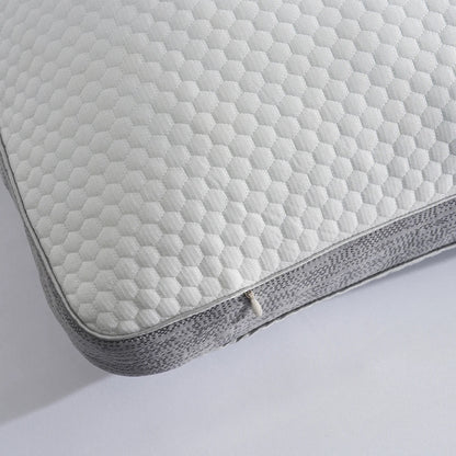 Close-up of a quilted cooling pillow cover on a white background