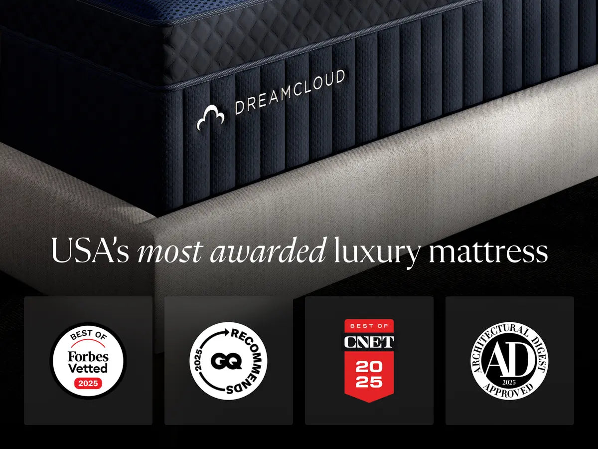 DreamCloud mattress with certification badges on a black background