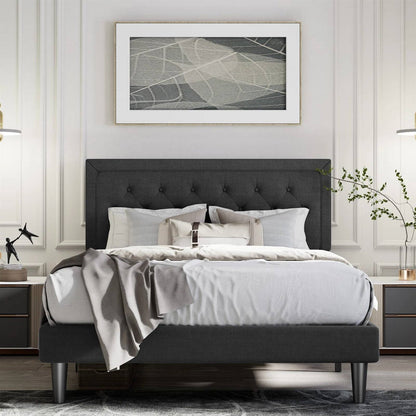 Full size black linen upholstered platform bed frame in a stylish bedroom with decorative elements.