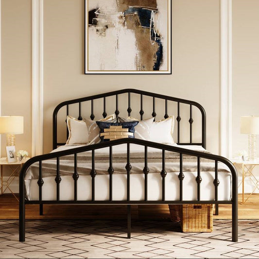 Black metal full size bed frame with white bedding in a room with abstract art on the wall.