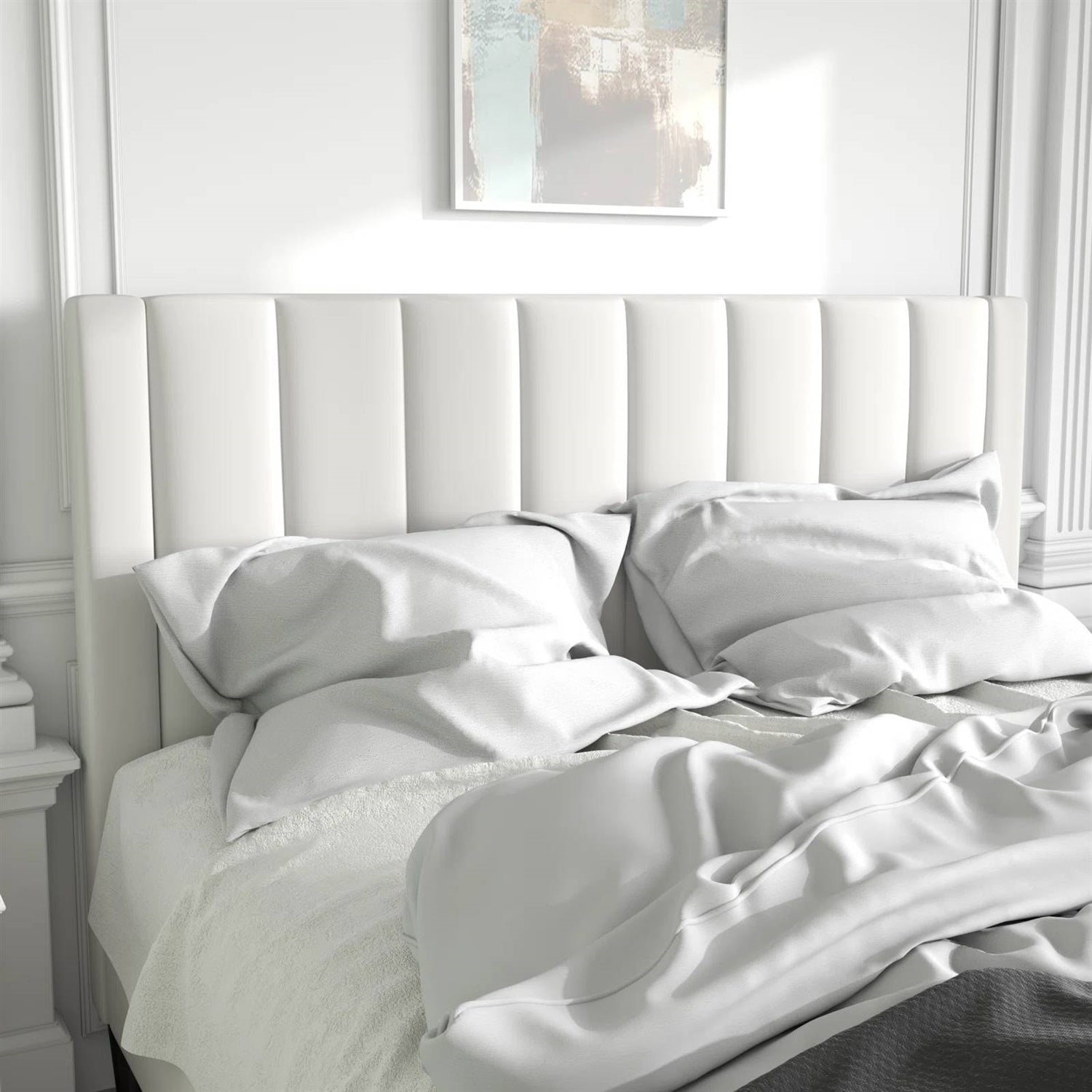 White velvet bed frame with striped headboard in a bright bedroom