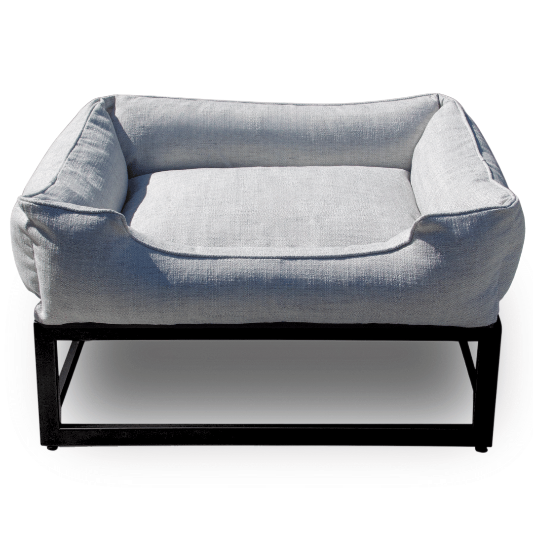 Gray pet bed with a black metal frame on a white background