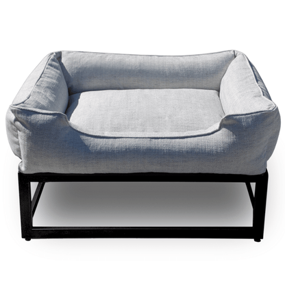 Gray pet bed with a black metal frame on a white background