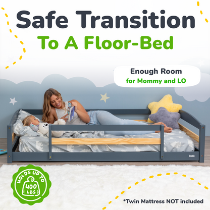 Advertisement for a floor-bed with a mother and child on it, featuring text about a safe transition to a floor-bed.