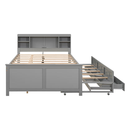 Gray trundle bed frame with storage drawers on a white background
