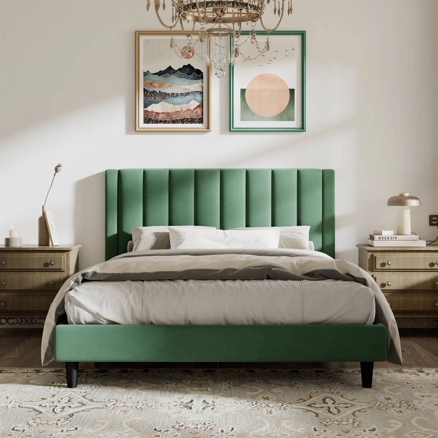 Queen size green velvet upholstered bed in a bedroom with framed artwork on the wall.