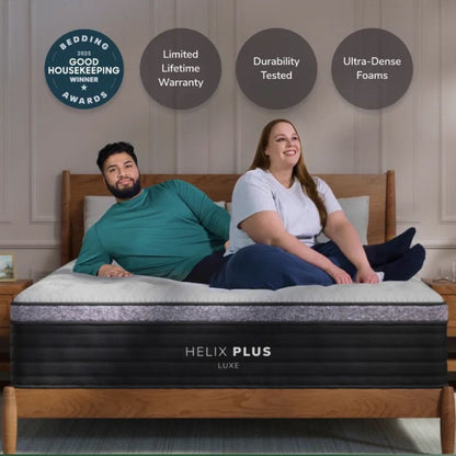 couple on a helix plus luxe mattress with awards from good housekeeping displayed