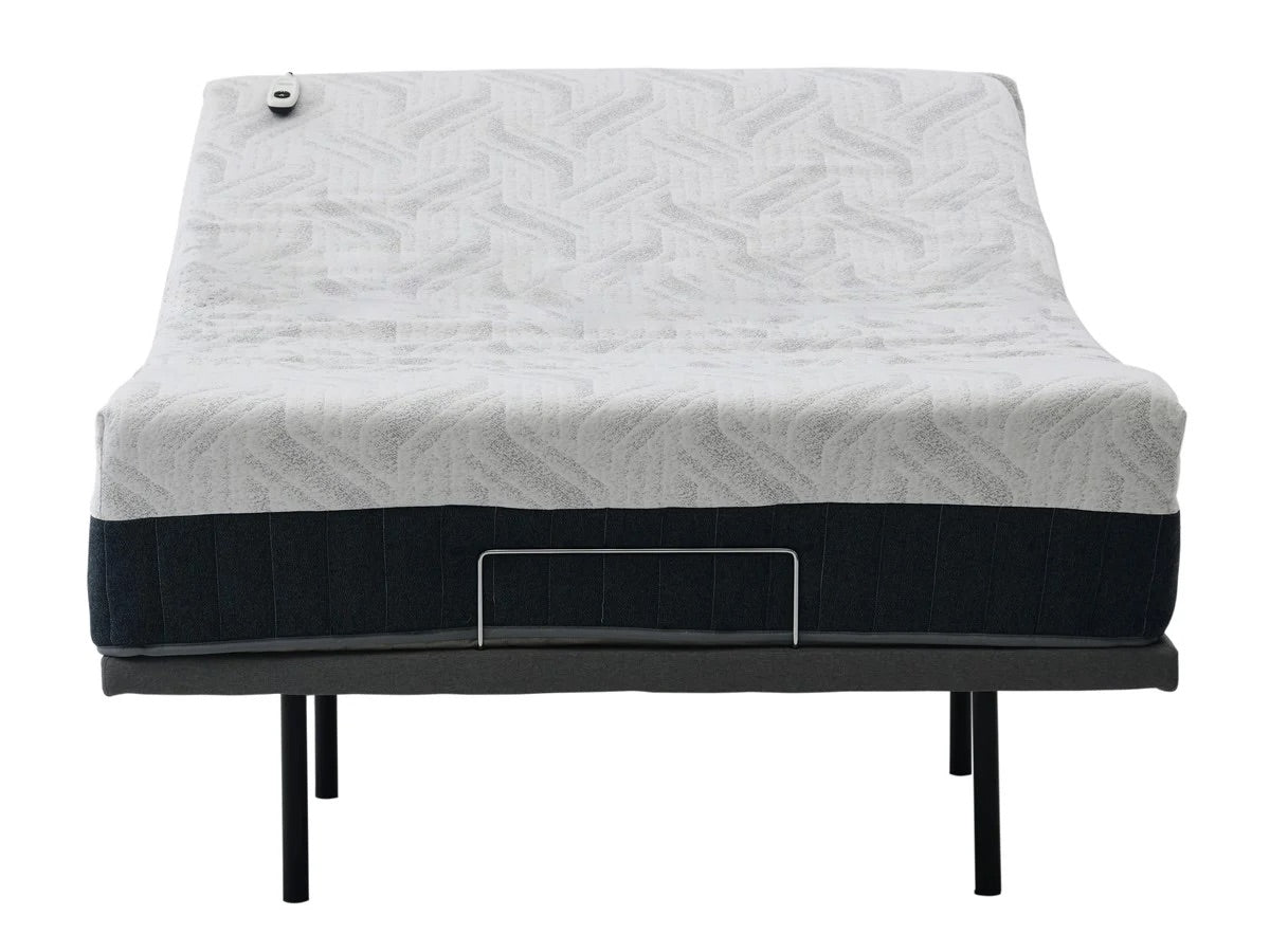 Mattress with a quilted cover on an adjustable bed frame base on white background