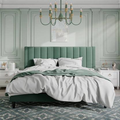 King size green velvet upholstered platform bed frame in a stylish bedroom with a chandelier and decorative elements.