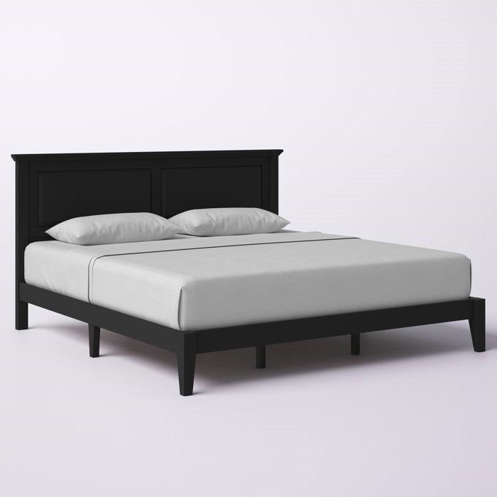 King size black bed frame with white mattress and pillows on a light gray background