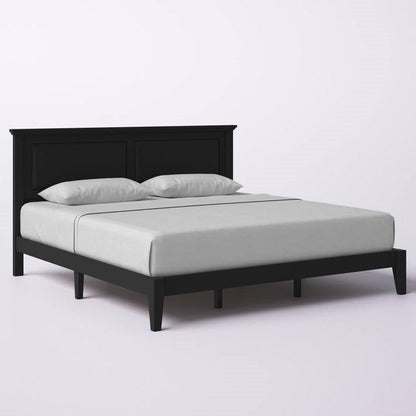 King size black bed frame with white mattress and pillows on a light gray background