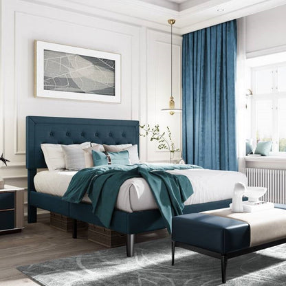 Modern bedroom with King size blue bed and matching ottoman, white walls, and large window.