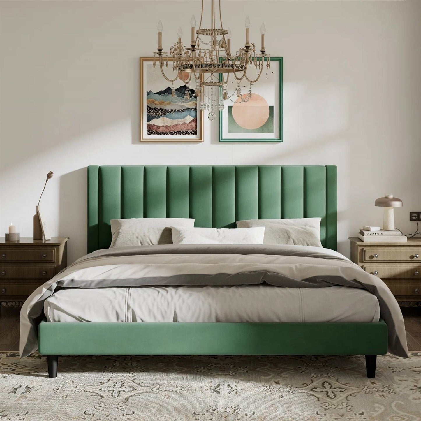 King size green velvet upholstered bed in a bedroom with a chandelier and framed artwork on the wall.