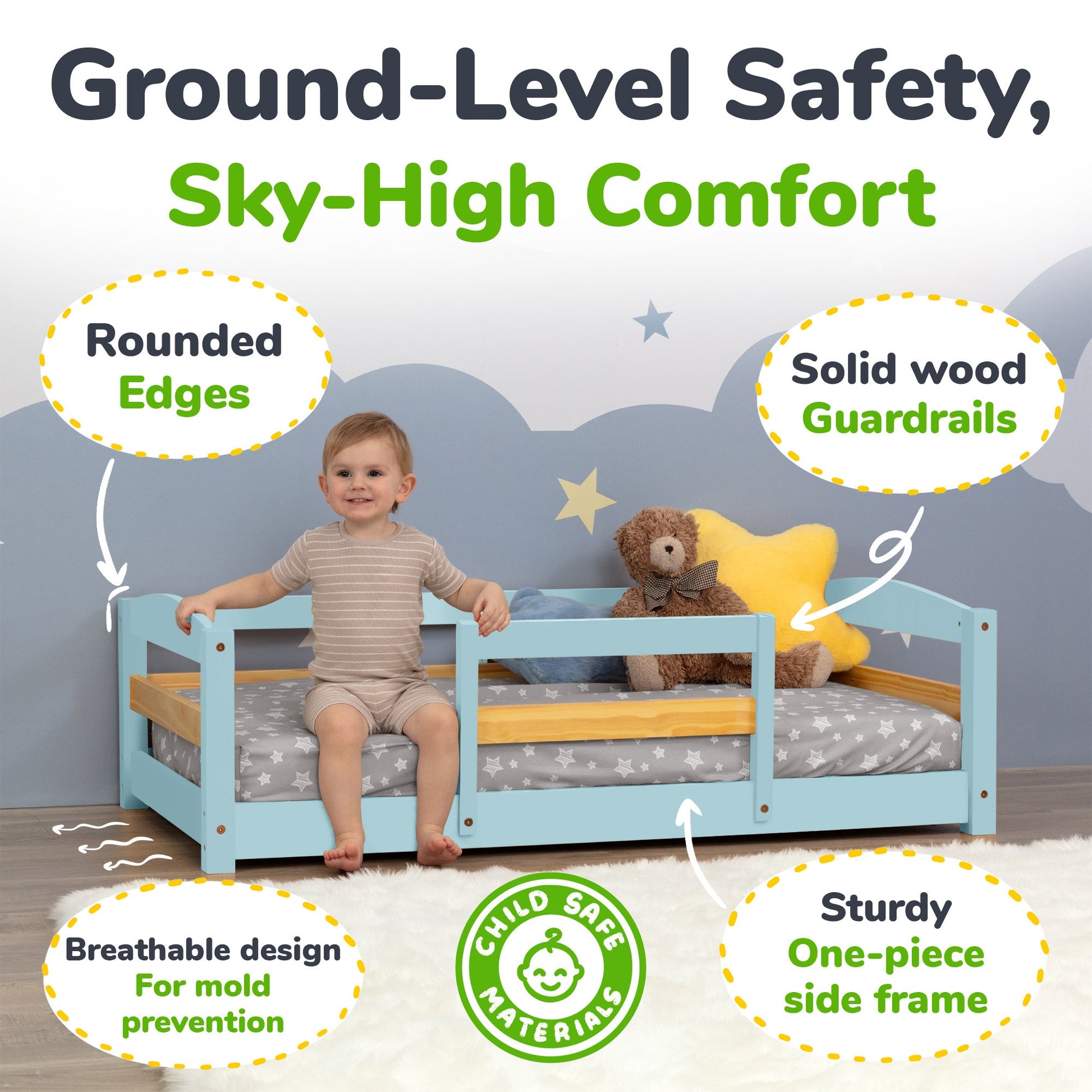 Child sitting on a blue bed with safety features highlighted, including rounded edges and solid wood guardrails.