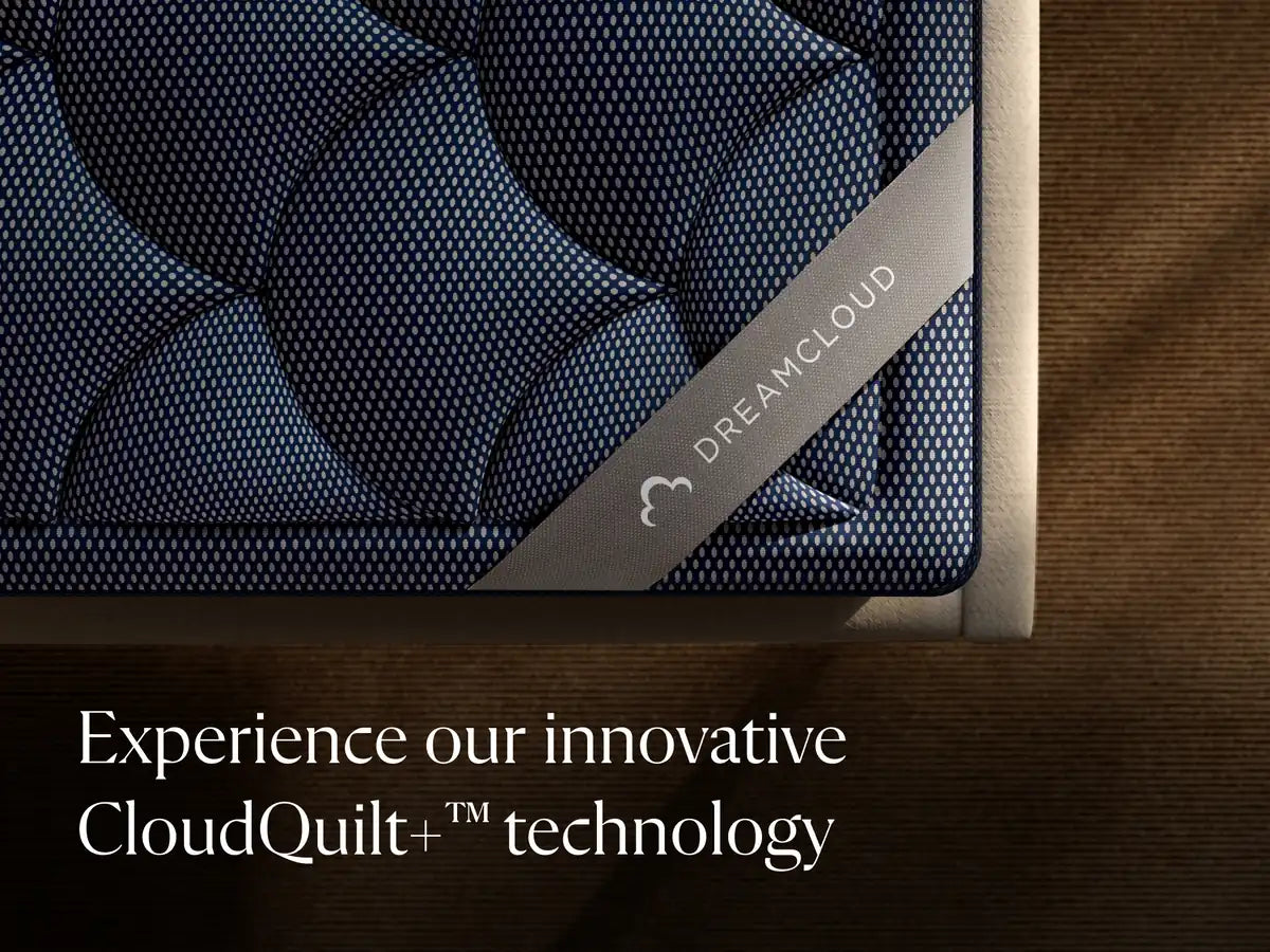 DreamCloud mattress with CloudQuilt+ technology label on a wooden surface